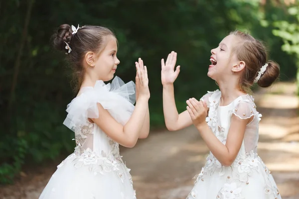 Happy beautiful girls with white wedding dresses — Stock Photo, Image