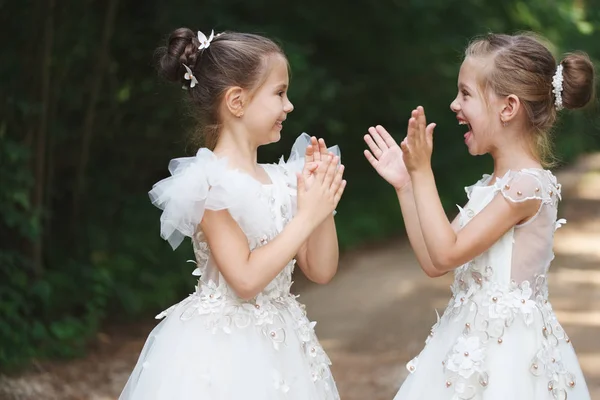 Happy beautiful girls with white wedding dresses — Stock Photo, Image