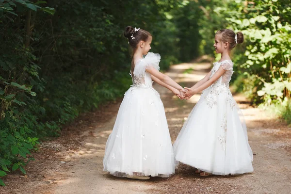 Happy beautiful girls with white wedding dresses — Stock Photo, Image