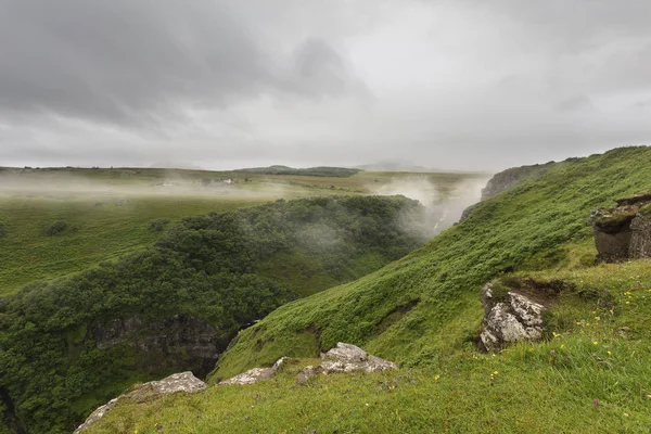 Landscape of the misty valley in Isle of Skye with dark clouds — Stock Photo, Image
