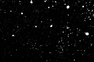 Kar fırtınası doku. Siyah arka plan, ışıkları bokeh vurdu kar taneleri havada uçan