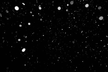 Kar fırtınası doku. Siyah arka plan, ışıkları bokeh vurdu kar taneleri havada uçan