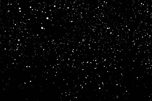 Kar fırtınası doku. Siyah arka plan, ışıkları bokeh vurdu kar taneleri havada uçan