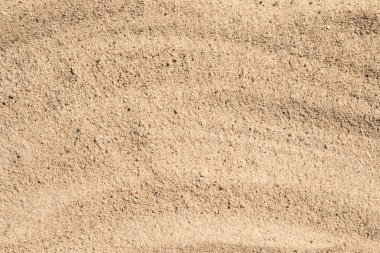 Arka plan olarak sarı kum yüzeyi