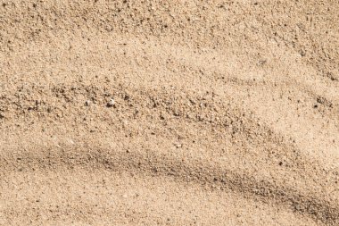 Arka plan olarak sarı kum yüzeyi