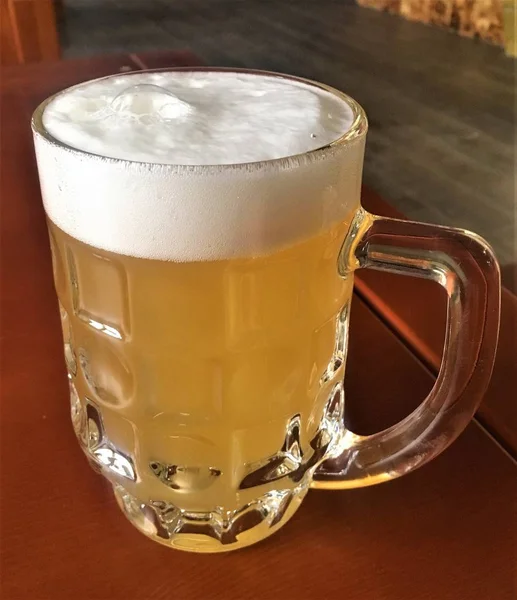 Beer glass in bar — Stock Photo, Image