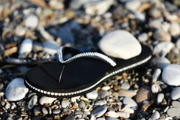 Rubber Shoes Beach Pebbles — Stock Photo, Image