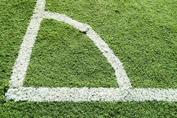 Artificial turf football with white stripe