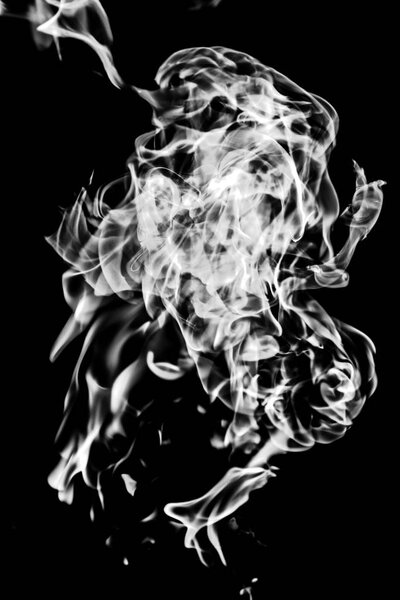 White smoke on a black background, abstraction