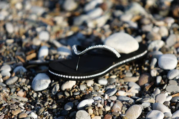 Rubber Shoes Beach Pebbles — Stock Photo, Image