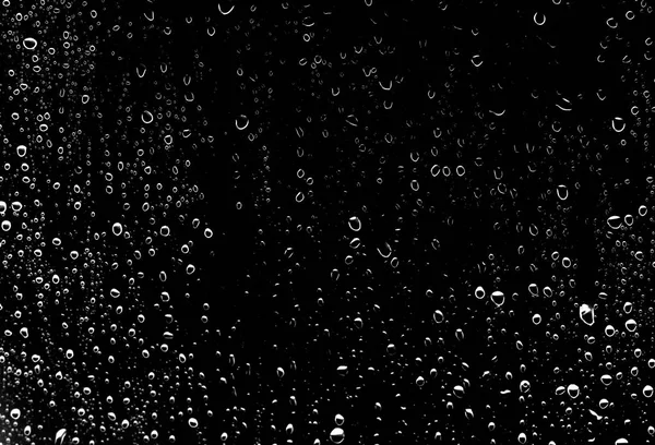 Raindrops on black glass, wet glass texture
