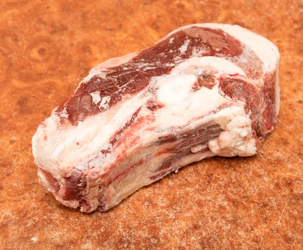 meat frozen piece of beef on the table