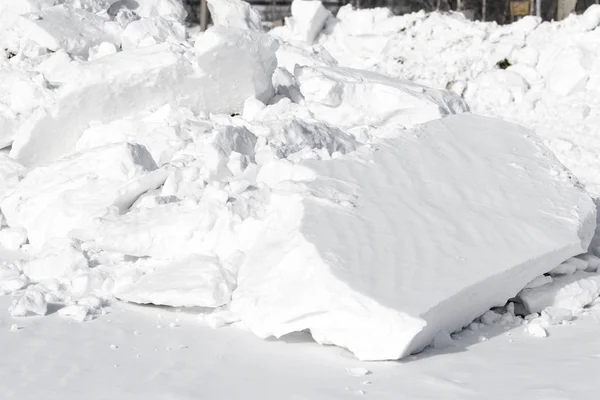 white snow pile lumps