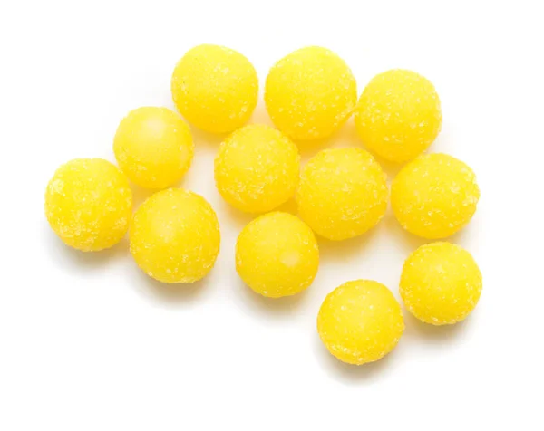 stock image round yellow sugar candy on white