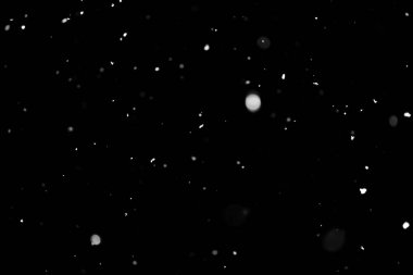 Kar fırtınası doku. Siyah arka plan, ışıkları bokeh vurdu kar taneleri havada uçan