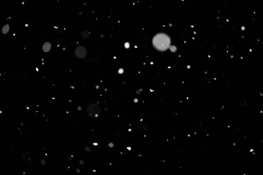 Kar fırtınası doku. Siyah arka plan, ışıkları bokeh vurdu kar taneleri havada uçan