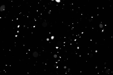 Kar fırtınası doku. Siyah arka plan, ışıkları bokeh vurdu kar taneleri havada uçan