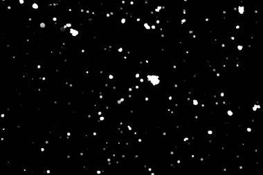 siyah kar bokeh arka plan üzerinde beyaz noktalar