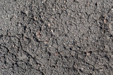 Eski asfalt arka plan ile bir çatlamak