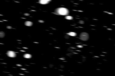 hareket bulanık siyah bir arka plan üzerinde beyaz noktalar kar