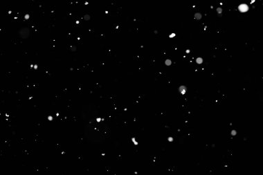 Kar fırtınası doku. Siyah arka plan, ışıkları bokeh vurdu kar taneleri havada uçan