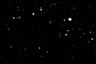 Kar fırtınası doku. Siyah arka plan, ışıkları bokeh vurdu kar taneleri havada uçan