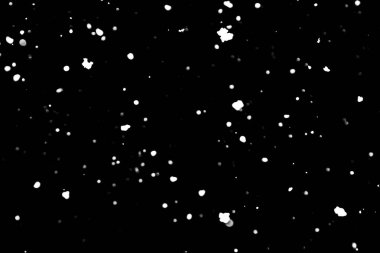 siyah kar bokeh arka plan üzerinde beyaz noktalar