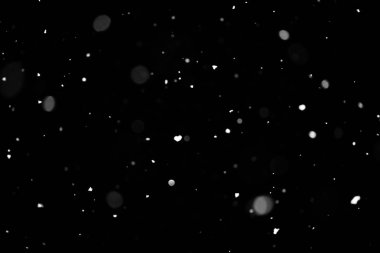 Kar fırtınası doku. Siyah arka plan, ışıkları bokeh vurdu kar taneleri havada uçan