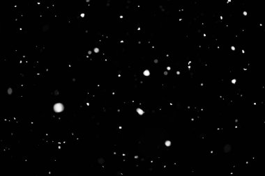 Kar fırtınası doku. Siyah arka plan, ışıkları bokeh vurdu kar taneleri havada uçan