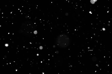 Kar fırtınası doku. Siyah arka plan, ışıkları bokeh vurdu kar taneleri havada uçan