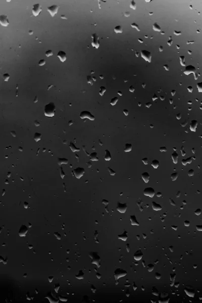 Σταγόνες Βροχής Ένα Φόντο Σκούρο Γυαλί — Φωτογραφία Αρχείου