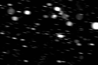 hareket bulanık siyah bir arka plan üzerinde beyaz noktalar kar