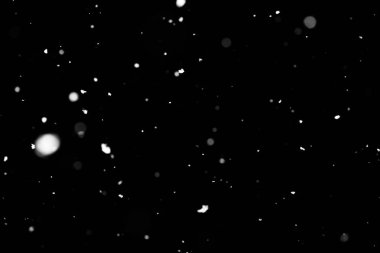 Kar fırtınası doku. Siyah arka plan, ışıkları bokeh vurdu kar taneleri havada uçan