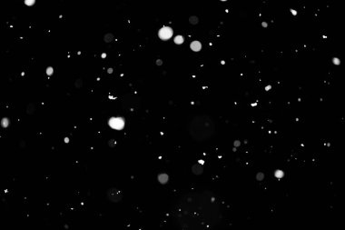 Kar fırtınası doku. Siyah arka plan, ışıkları bokeh vurdu kar taneleri havada uçan