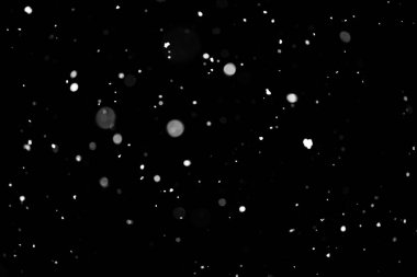 Kar fırtınası doku. Siyah arka plan, ışıkları bokeh vurdu kar taneleri havada uçan