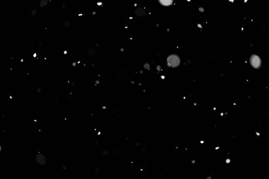 Kar fırtınası doku. Siyah arka plan, ışıkları bokeh vurdu kar taneleri havada uçan