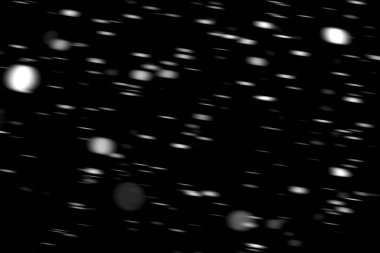 hareket bulanık siyah bir arka plan üzerinde beyaz noktalar kar