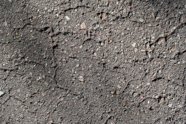 き裂を有する古いアスファルト背景 — ストック写真