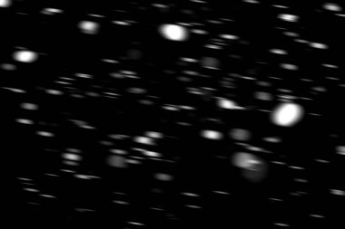 hareket bulanık siyah bir arka plan üzerinde beyaz noktalar kar