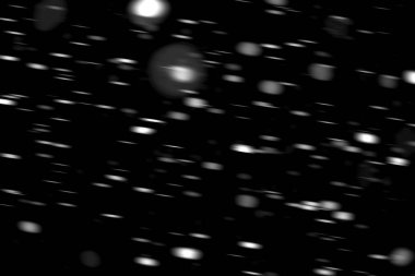 hareket bulanık siyah bir arka plan üzerinde beyaz noktalar kar