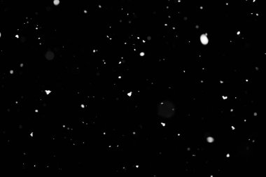 Kar fırtınası doku. Siyah arka plan, ışıkları bokeh vurdu kar taneleri havada uçan