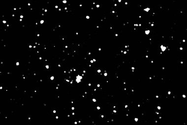 siyah kar bokeh arka plan üzerinde beyaz noktalar