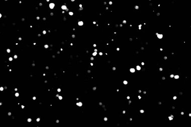 siyah kar bokeh arka plan üzerinde beyaz noktalar