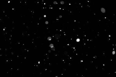 Kar fırtınası doku. Siyah arka plan, ışıkları bokeh vurdu kar taneleri havada uçan