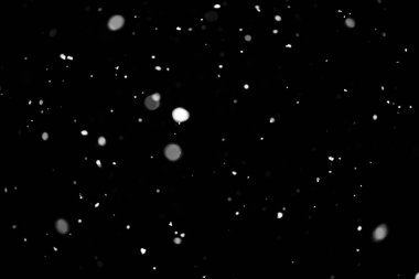 Kar fırtınası doku. Siyah arka plan, ışıkları bokeh vurdu kar taneleri havada uçan