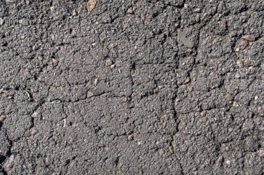 Eski asfalt arka plan ile bir çatlamak