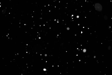 Kar fırtınası doku. Siyah arka plan, ışıkları bokeh vurdu kar taneleri havada uçan