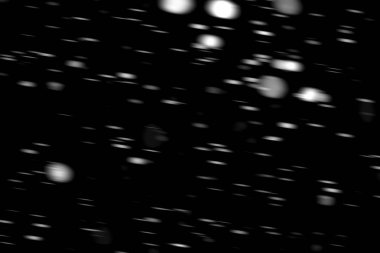 hareket bulanık siyah bir arka plan üzerinde beyaz noktalar kar