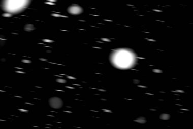 hareket bulanık siyah bir arka plan üzerinde beyaz noktalar kar