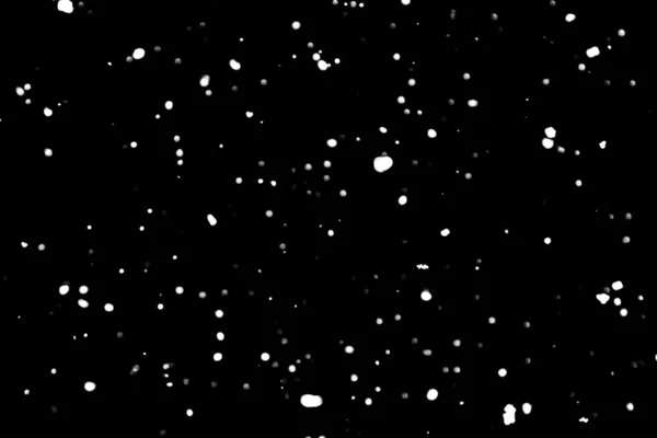 white dots on black snow bokeh background